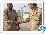 Phillip with current Joint Chief of Staff Admiral Michael Mullen in Al Anbar province, Iraq, in 2006.